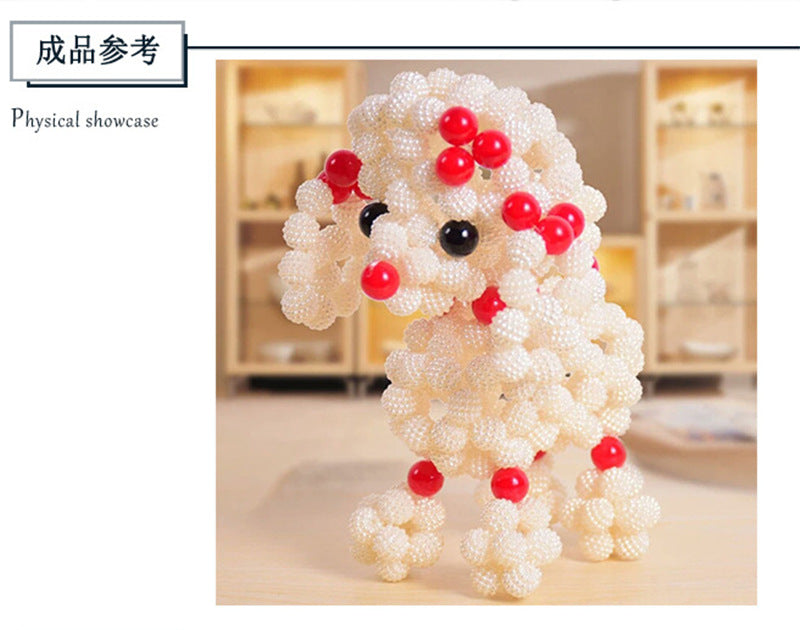 A white, fluffy, dog-shaped figurine made of pearl beads is displayed on a wooden surface.