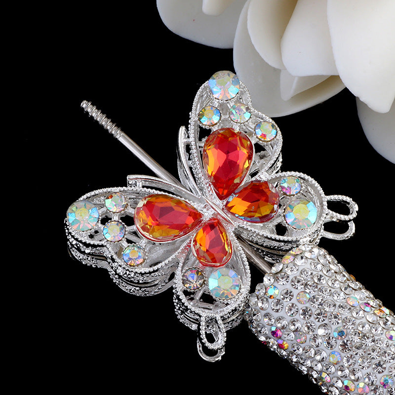 Silver crystal butterfly beads with orange and red gemstone accents