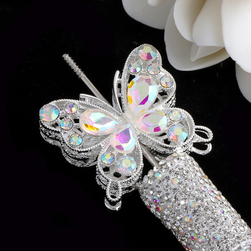 Silver crystal butterfly beads with iridescent accents attached to a silver cylindrical bead.