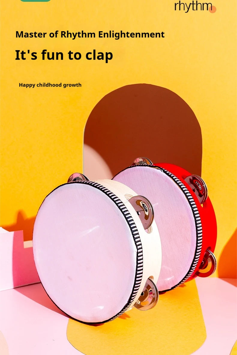 Pink and red hand-held tambourines with metal jingles displayed against a yellow background.