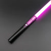 A close-up view of an RGB lightsaber toy with a purple metal handle and glowing pink blade against a dark gray background.