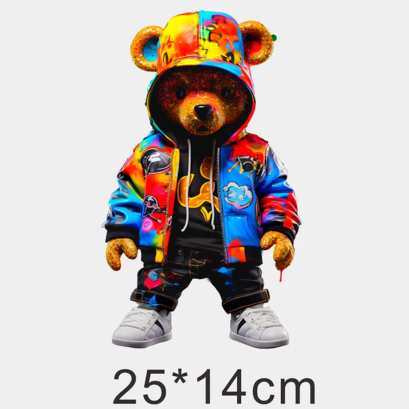A stuffed bear costume with a hood featuring colorful graffiti patches and a hoodie.
