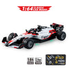 A white and red 1:64 classic car model racing on a surface, with a remote control system box nearby.