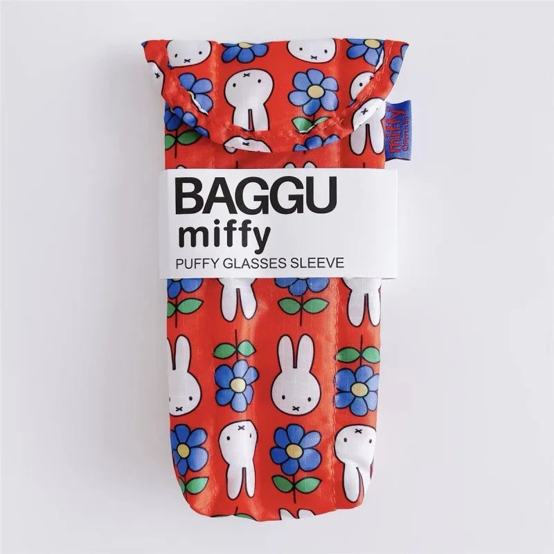 A red fabric storage bag featuring a repeating pattern of white Miffy rabbit faces and blue flowers.