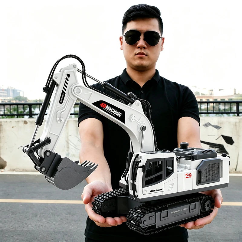 A man holds a white RC excavator engineering truck with an attached hydraulic arm and bucket.