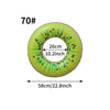 A green inflatable pool float ring shaped like a slice of fruit with black seeds.