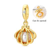 Gold-tone pendant set featuring a starfish, sea turtle, and whale shark charm with an opening mechanism.