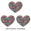 A heart-shaped floral embroidery patch featuring pink, purple, and green flowers.