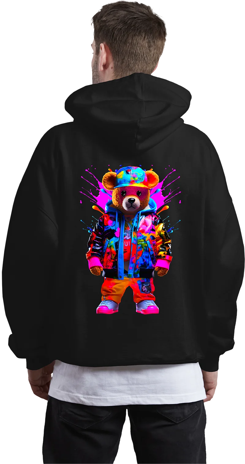 A person wearing a black hoodie displays a graphic of a bear with colorful graffiti patches on its fur.