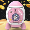 Pink rocket shaped piggy bank with a panda face inside, set against a dark space background.