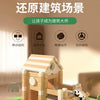 A wooden log cabin building kit for children, showing various components and a completed structure on green grass.