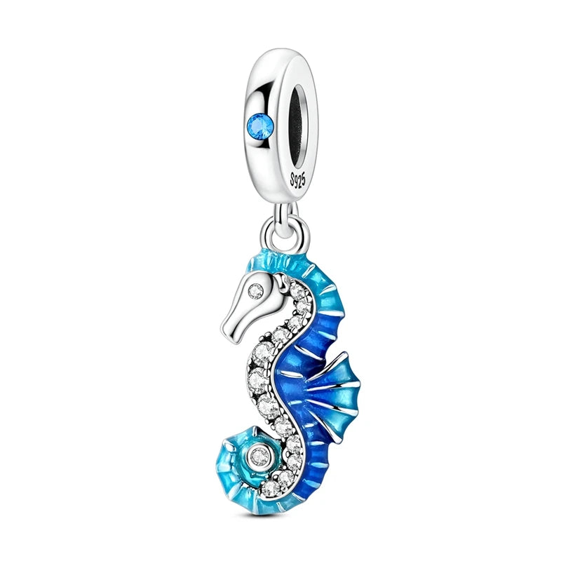 Sterling silver charm pendant set featuring starfish, sea turtle, and whale shark designs
