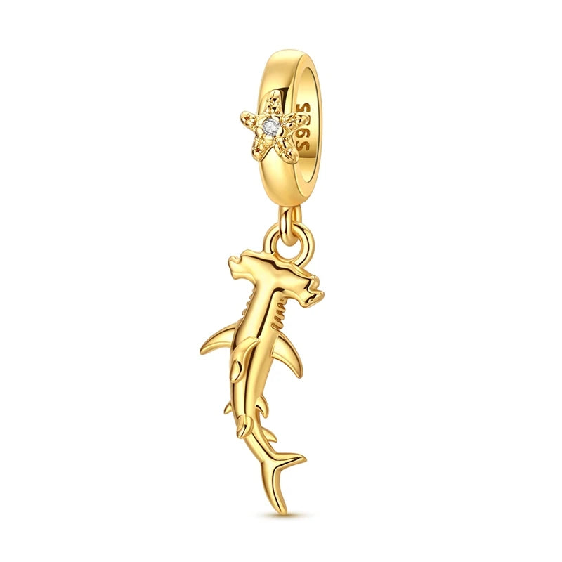 Gold-tone Sterling silver charm pendant set featuring a starfish, sea turtle, and whale shark.