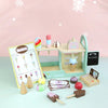 A wooden ice cream counter play set with various ice cream items and tools for children.