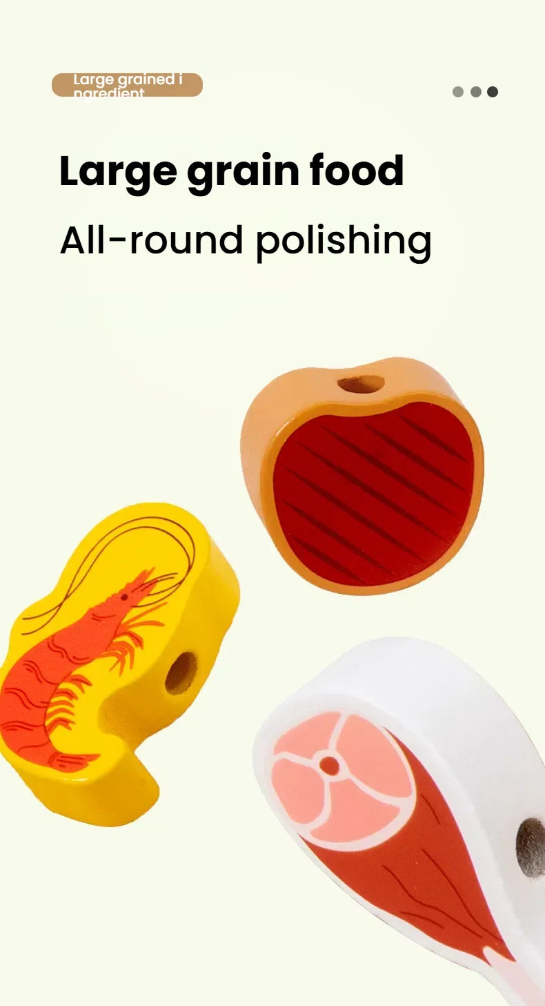 A wooden BBQ playset featuring a grill and food items, including a yellow crab and a pink fish slice.