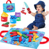 A baby is playing with a Montessori cloth fishing game featuring stacking cups and counting elements.