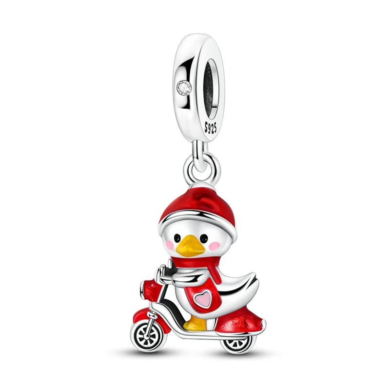 Sterling silver charm bead pendant depicting a reindeer riding a motorcycle.