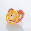 A baby pacifier set featuring a yellow lion design with orange and white silicone teats.