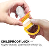 A hand is holding a yellow and orange silicone pacifier set with a clear teat, demonstrating a childproof lock mechanism.