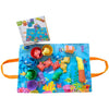 A Montessori cloth fishing game featuring stacking cups, colorful fish toys, and a fishing rod on an orange fabric.
