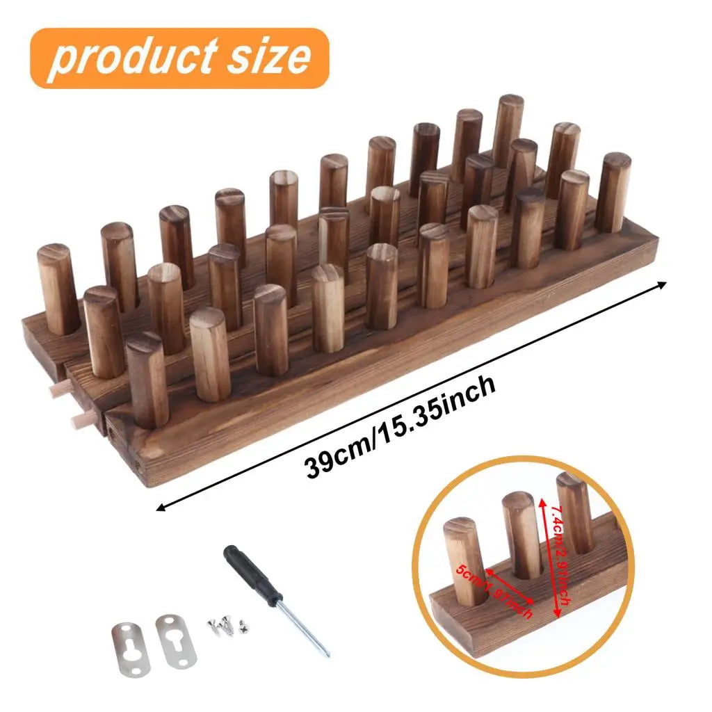 A wooden knitting loom with multiple wooden spindles and a small tool shown for product size reference.