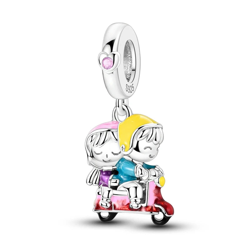 Sterling silver charm bead pendant featuring two figures riding a vintage scooter.