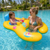 A woman and a child floating in a yellow inflatable pool lounger in a swimming pool.