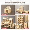 A wooden log cabin building kit showing various levels of construction from a small house to a tall building.