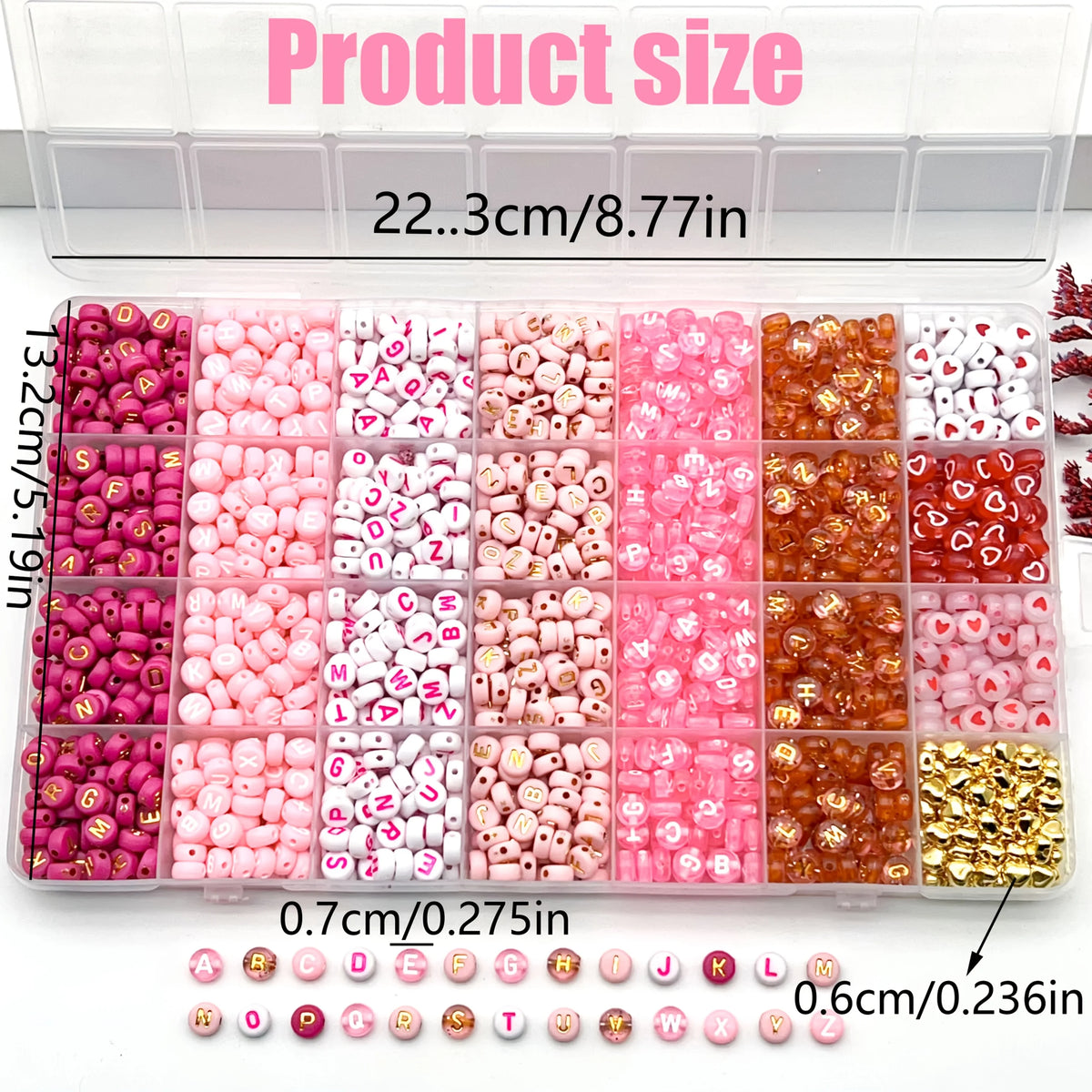 A variety of acrylic beads in pink, red, and white with gold accents are displayed in small compartments.