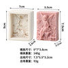 A pink silicone soap mold shaped like an angel girl with rose and butterfly designs.