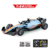 A blue and orange 1:64 classic car model RC crawler with a remote control system.