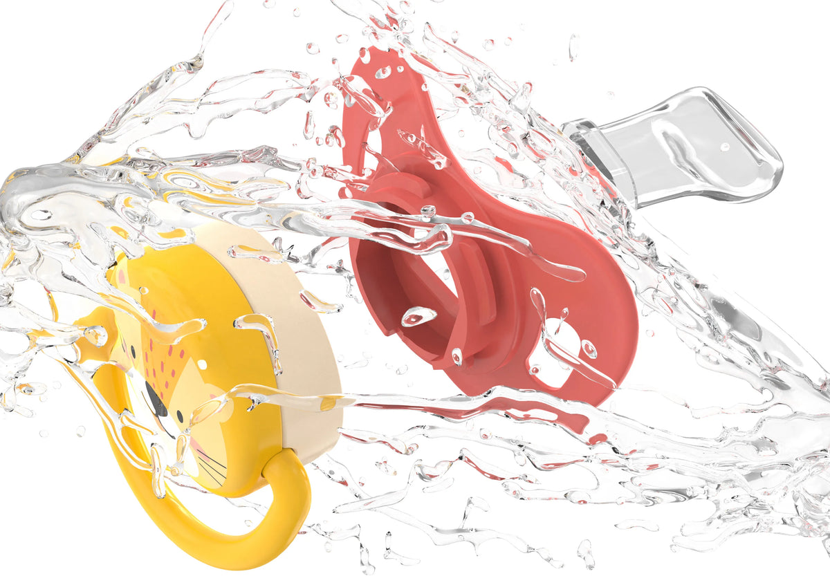 A baby pacifier set with six interchangeable silicone teats is shown being washed under running water.