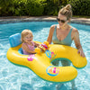 A woman is holding a yellow inflatable pool lounger for two with a sun canopy and backrest in a swimming pool.