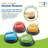 A set of four colorful answer buzzers for kids featuring siren, buzz, and laser sounds.