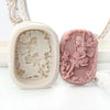 A silicone soap mold featuring a 3D flower fairy design with an angel girl, rose, and butterfly motif.