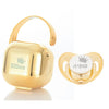 Gold personalized baby pacifier with a crown design and storage case
