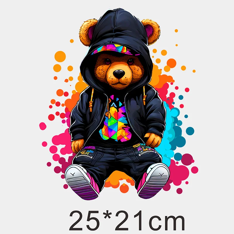 A cute bear wearing a hoodie with a colorful graffiti pattern, surrounded by paint splatters.