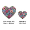A heart-shaped floral patch featuring various colored flowers and greenery for DIY clothing and accessories.