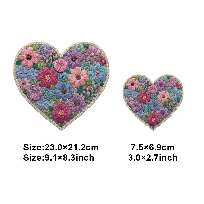 A heart-shaped floral patch featuring various colored flowers and greenery for DIY clothing and accessories.