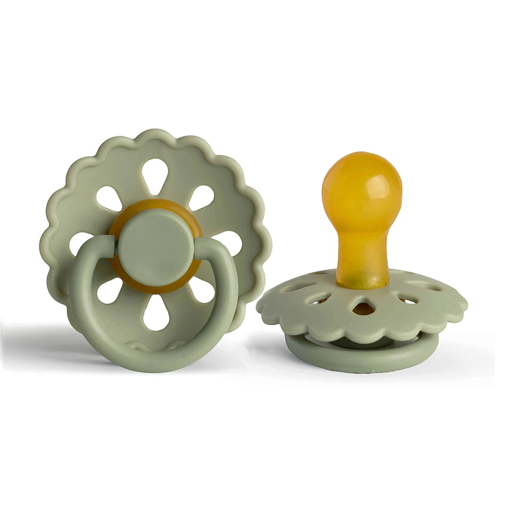 A natural latex baby pacifier in light green with a yellow silicone nipple and ring.