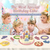 A wooden pretend play birthday cake set with various tools and decorations for children.