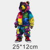 A cute bear wearing a colorful hoodie and matching pants with various iron-on patches
