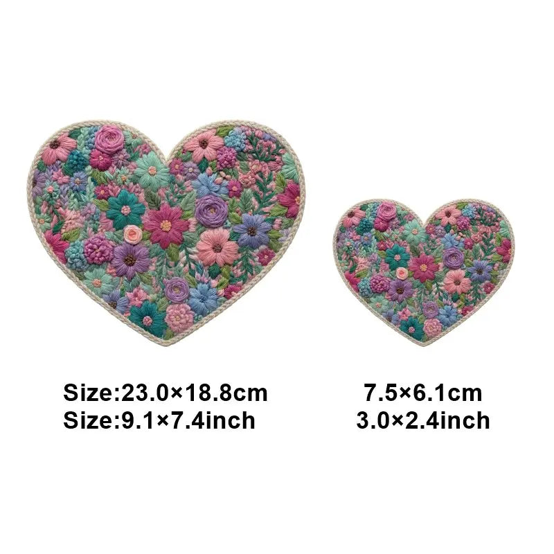 A heart-shaped floral patch featuring various pink, purple, and green flowers for DIY clothing and accessories.