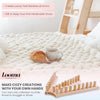 A wooden knitting loom is shown next to a fluffy white blanket, illustrating how to make cozy handmade throws.