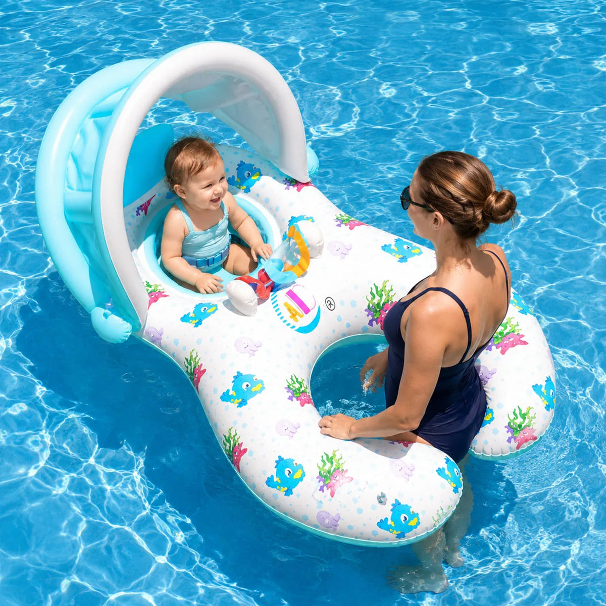 A woman is sitting in a blue inflatable pool lounger with a sun canopy, surrounded by clear blue water.