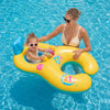 A woman is lying on a yellow inflatable pool lounger with a child in a bright blue swimming pool.
