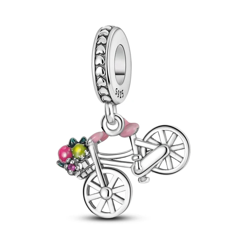 Sterling silver charm bead pendant featuring a bicycle, key, and other charms.