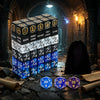 A stack of 63 dice in various colors and numbers rests on a stone surface in a dark, atmospheric setting.
