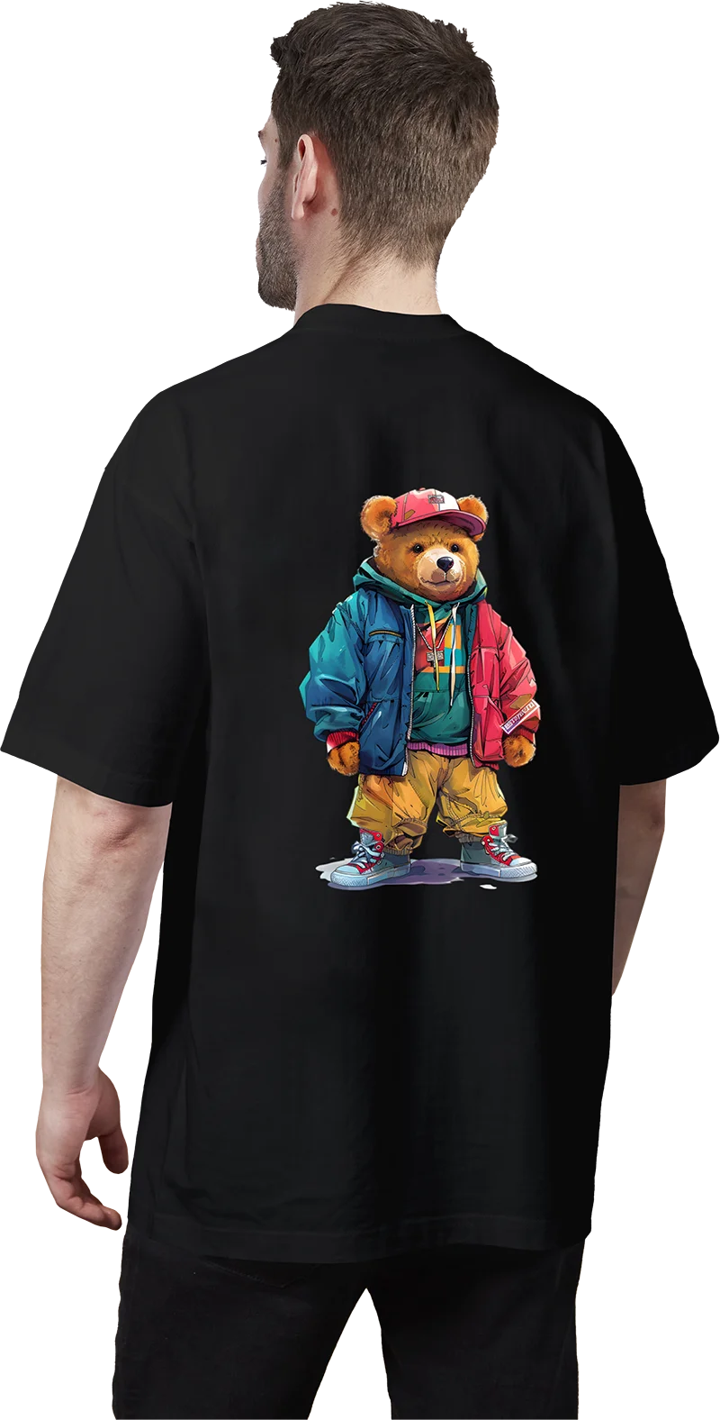 A person wearing a black t-shirt featuring a graphic of a bear in a blue jacket and yellow pants.