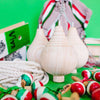 Three unfinished wooden spinning tops with steel points for a paint your own craft toy set
